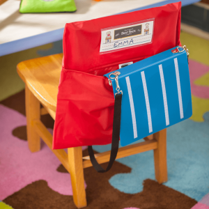 Red chair organizer, child's supplies.