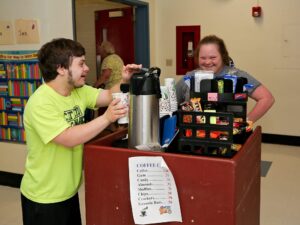 Young adults working at a snack stand