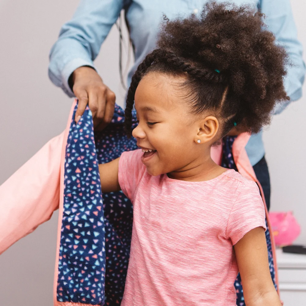 Teaching Critical Communication Skills Online Workshop Girl getting dressed, happy child.